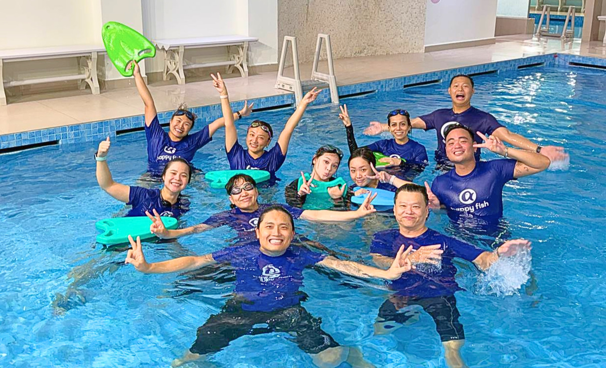 The Happy Fish coaching team in the pool